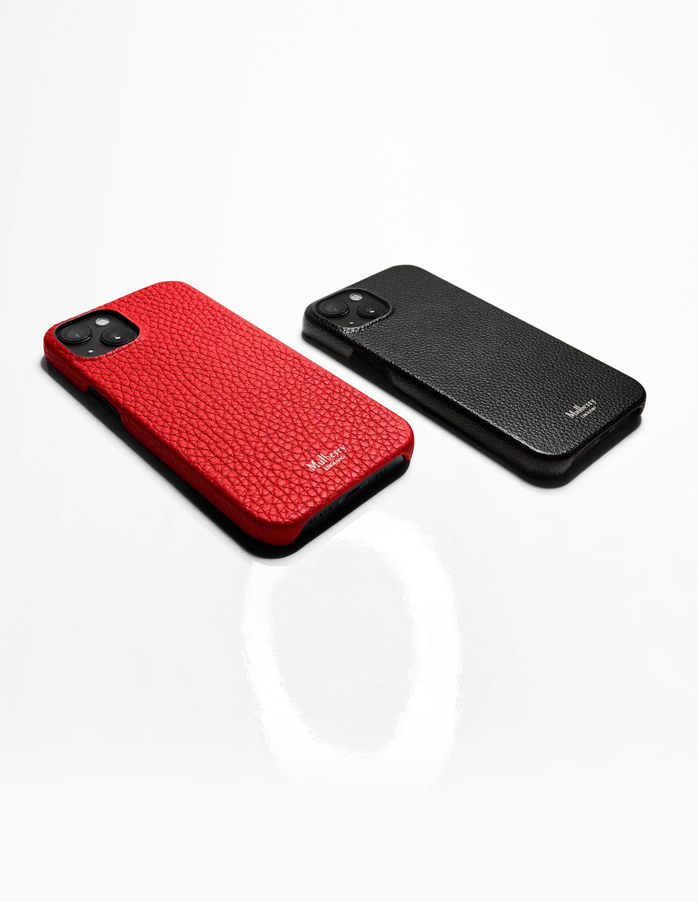 Two Mulberry iPhone cases in red and black